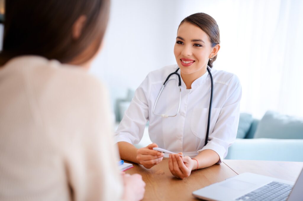 162000808_m_normal_none Doctor consulting with a patient at a desk