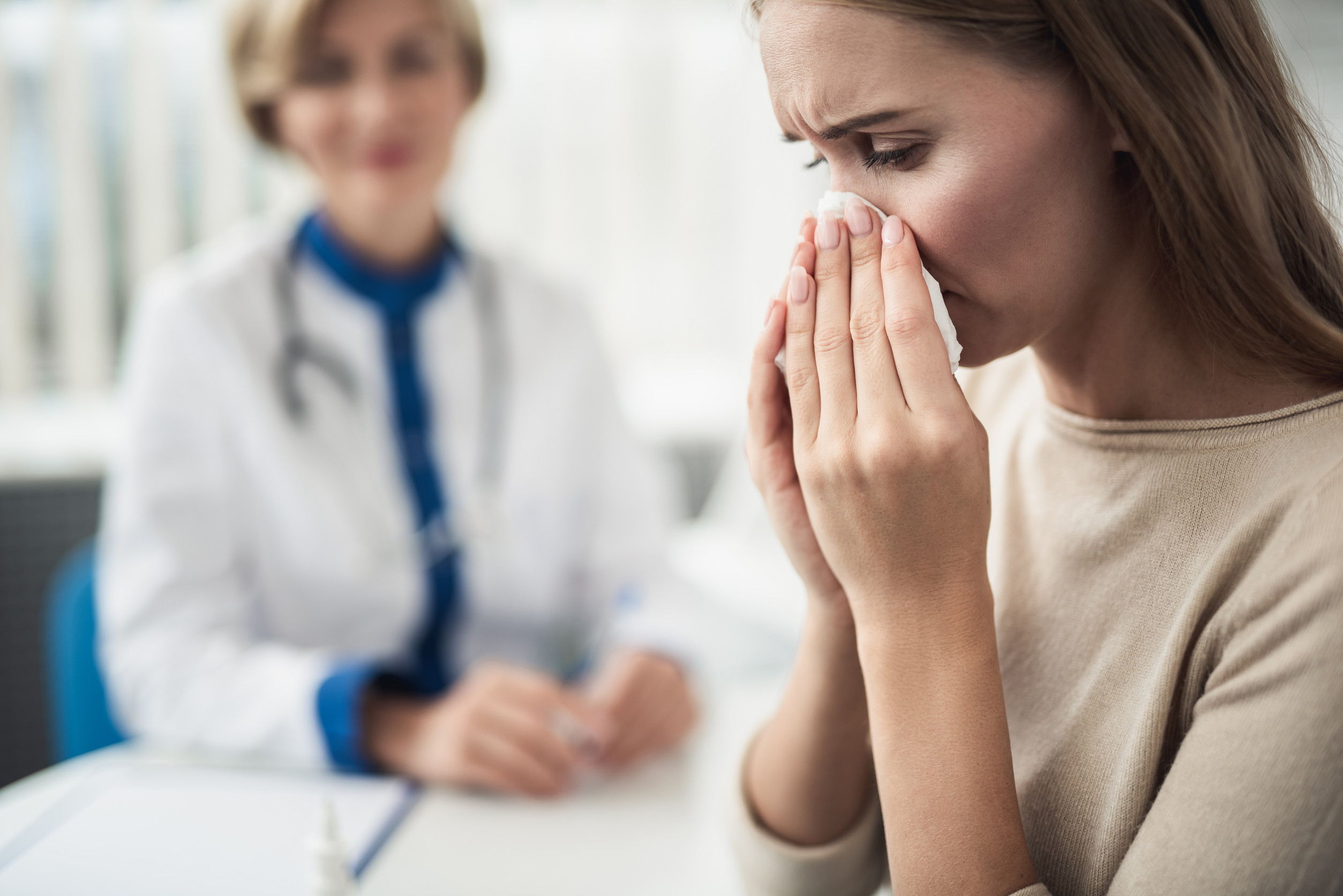 Medical consultation of young woman in clinic seasonal healthcare marketing